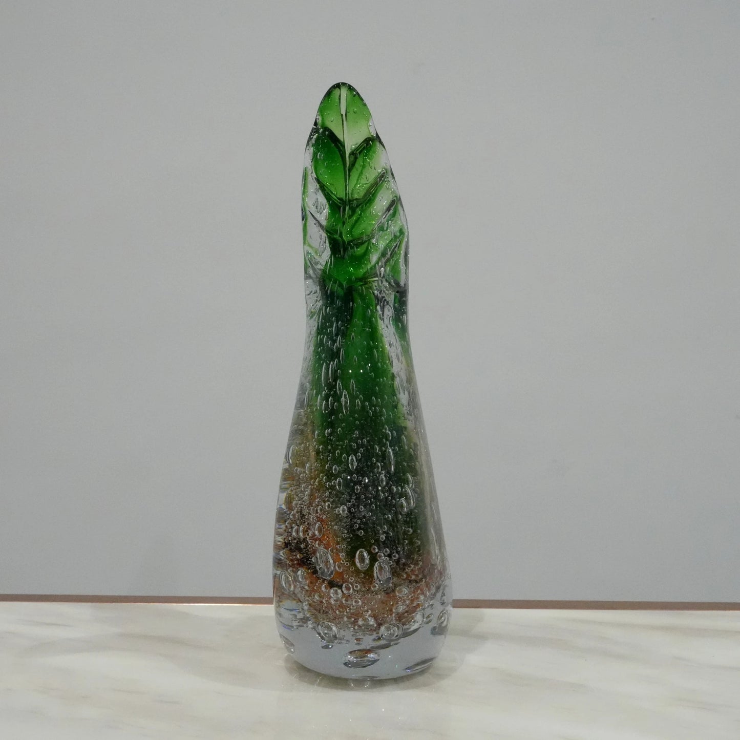 Handcrafted decorative glass vase with twisted horn silhouette and artistic gradient finish for luxury living room styling