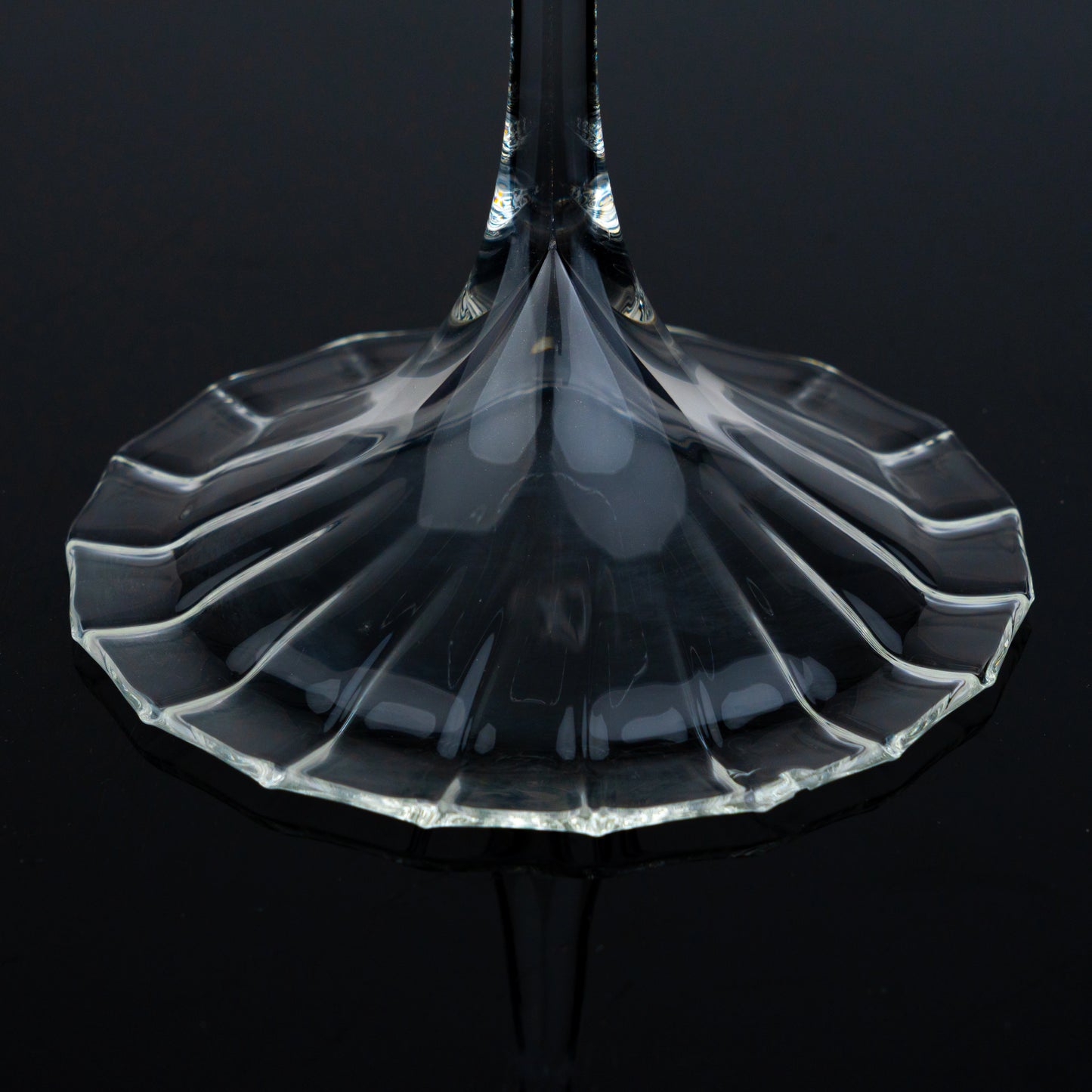Fluted cocktail glass starburst foot top-down