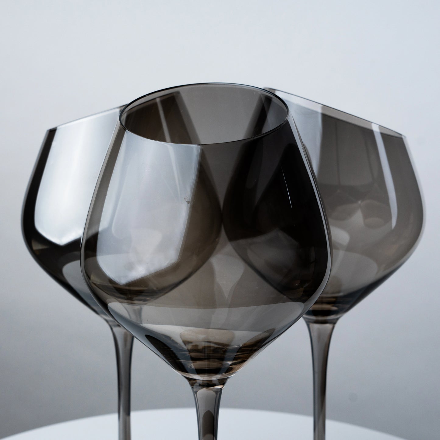 set of 4 smokey grey wine glasses with tall stem and curved bowl