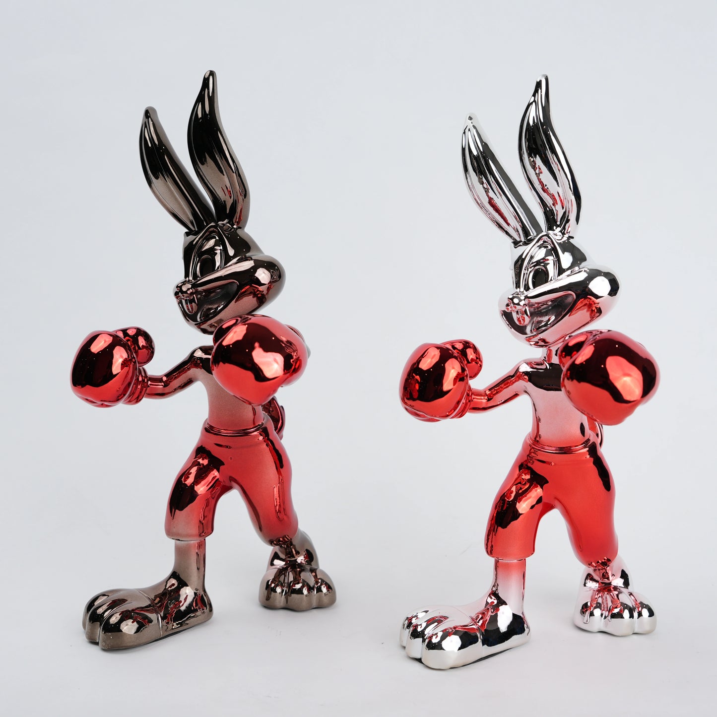 Resin bunny boxer figurine with chrome silver finish and crimson red gloves and shorts