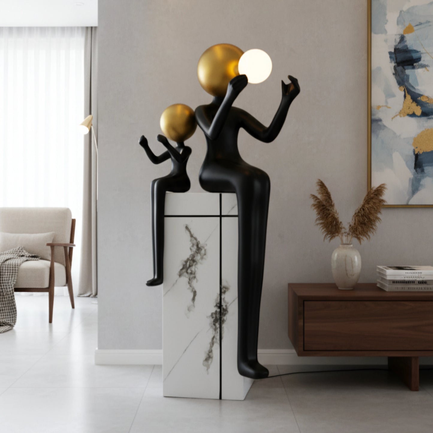 Black and gold human figurine duo holding a glowing orb on a marble pedestal sculpture