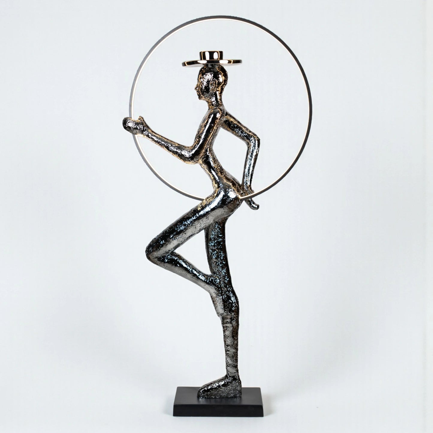 Silver electroplated human sculpture with glowing LED halo — Auric Poise Sculpture by Ghar Art, handcrafted metallic luxury home decor accent symbolizing balance and radiance.