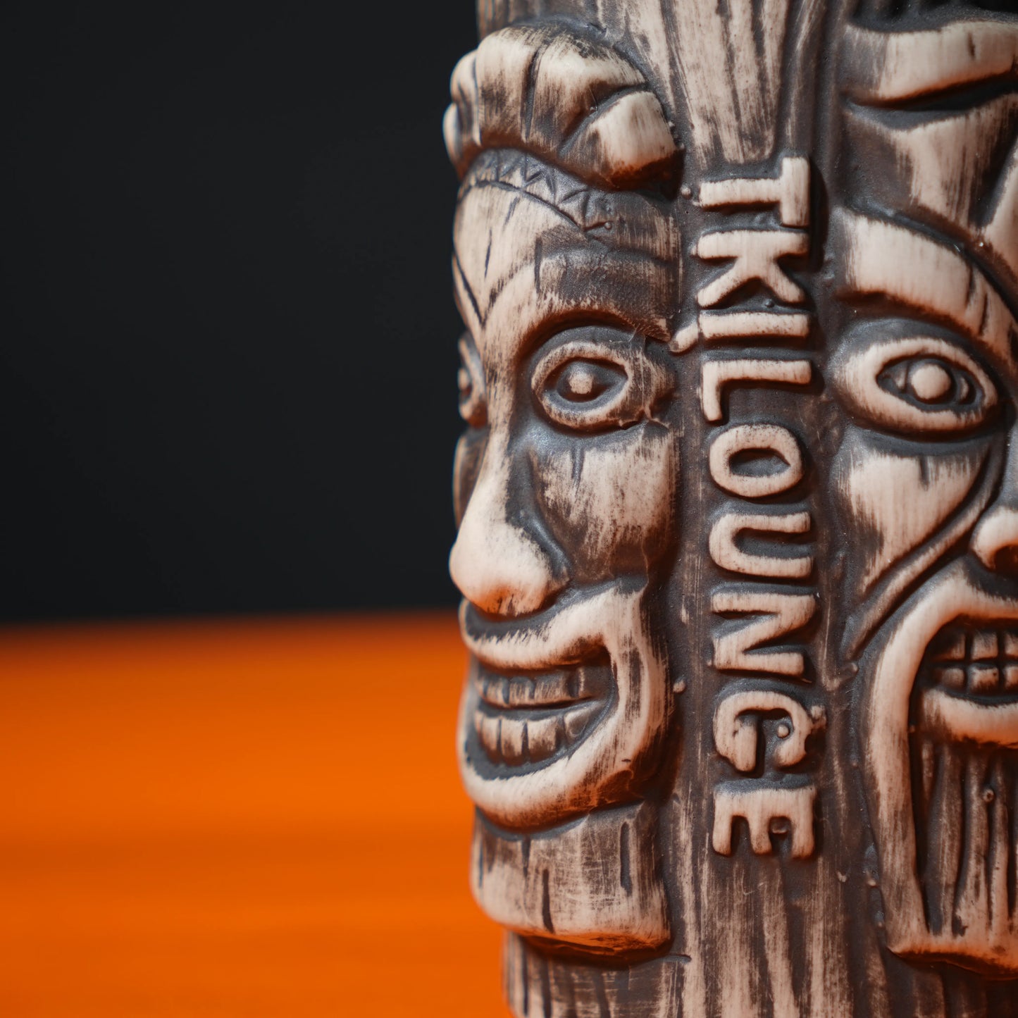 ceramic tribal tiki mug with carved faces