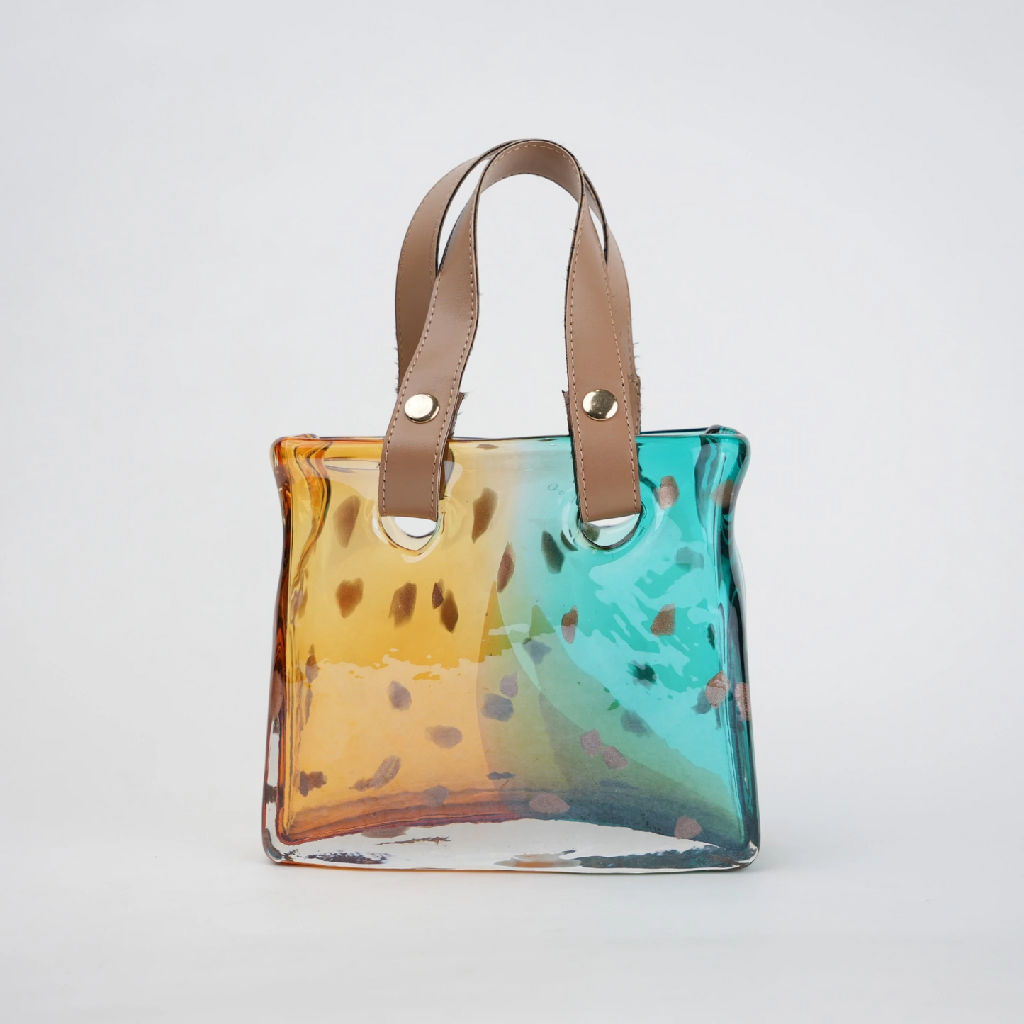 Dual-tone teal and amber glass handbag-shaped vase with bubble-textured surface and arched handle