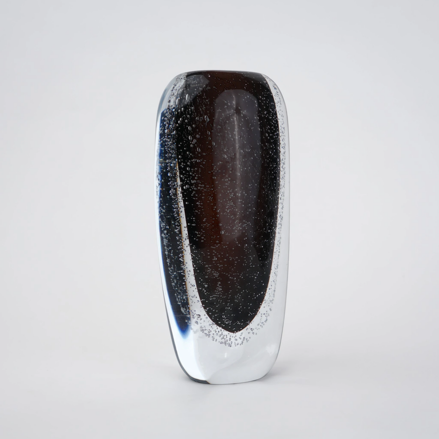 Smoked brown double-layer glass vase with clear outer shell and elongated oval shape.