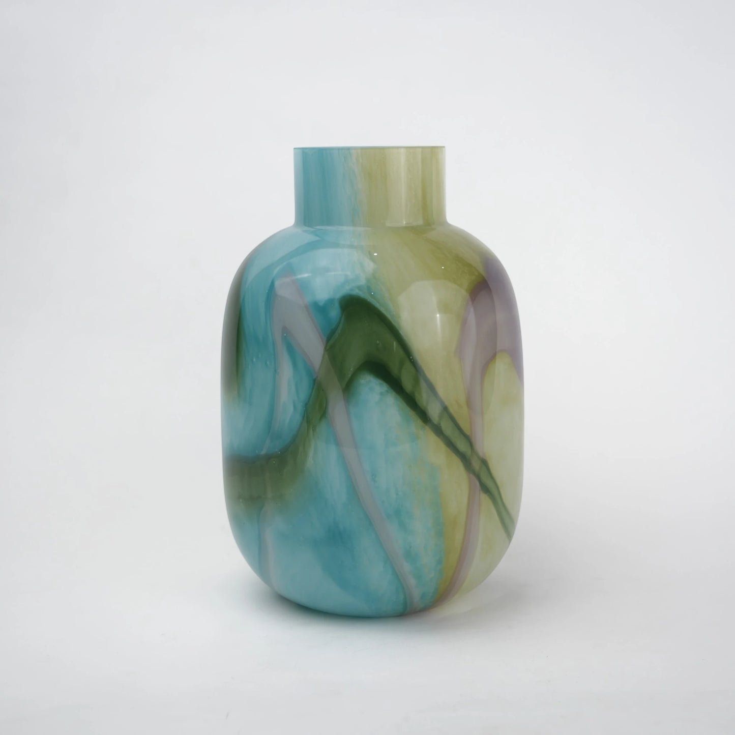 Blue marble effect glass vase with a smooth glossy finish, featuring a rounded body and short cylindrical neck, designed as a modern decorative piece for home decor styling.