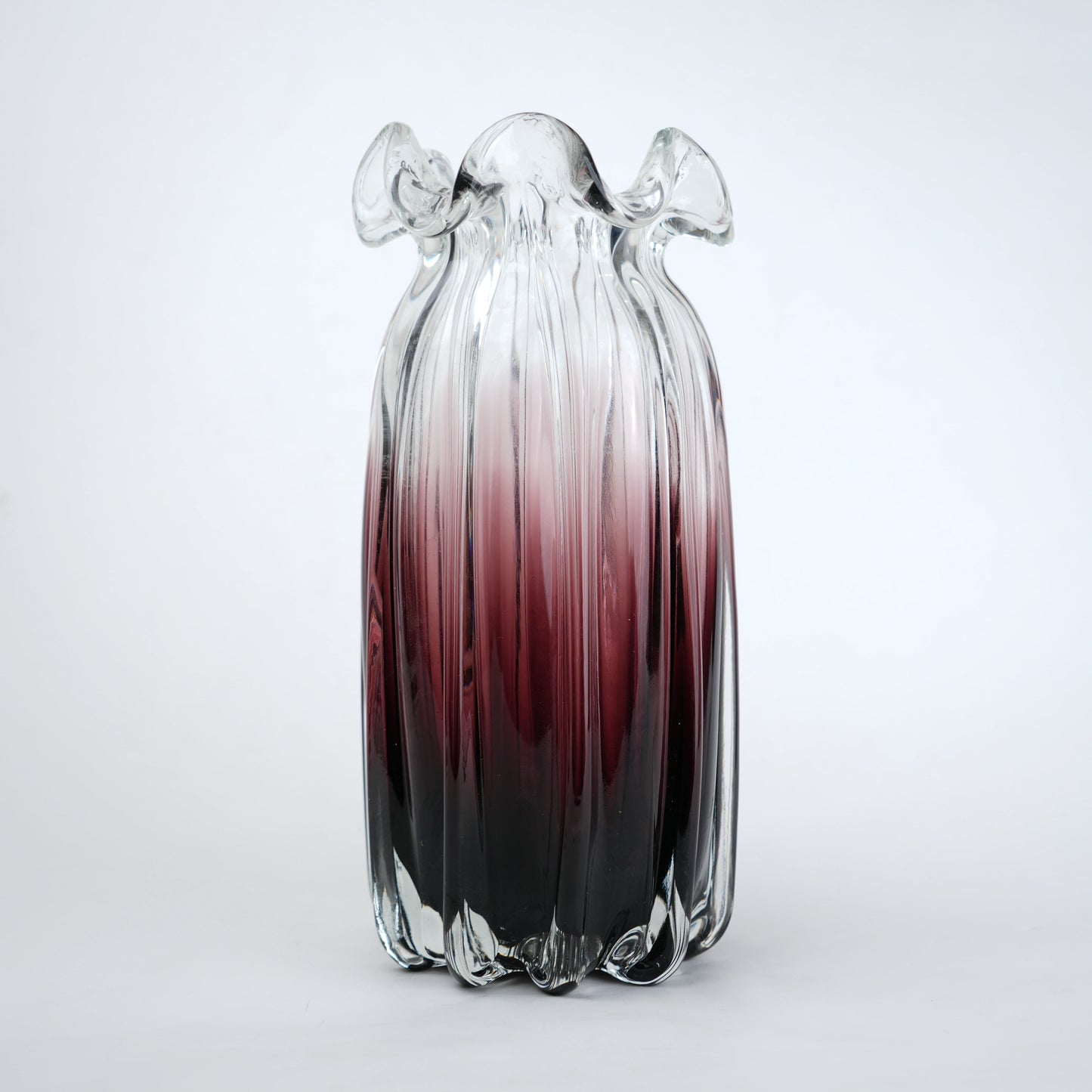 Blush and black ombre glass vase with ribbed texture and flared rim