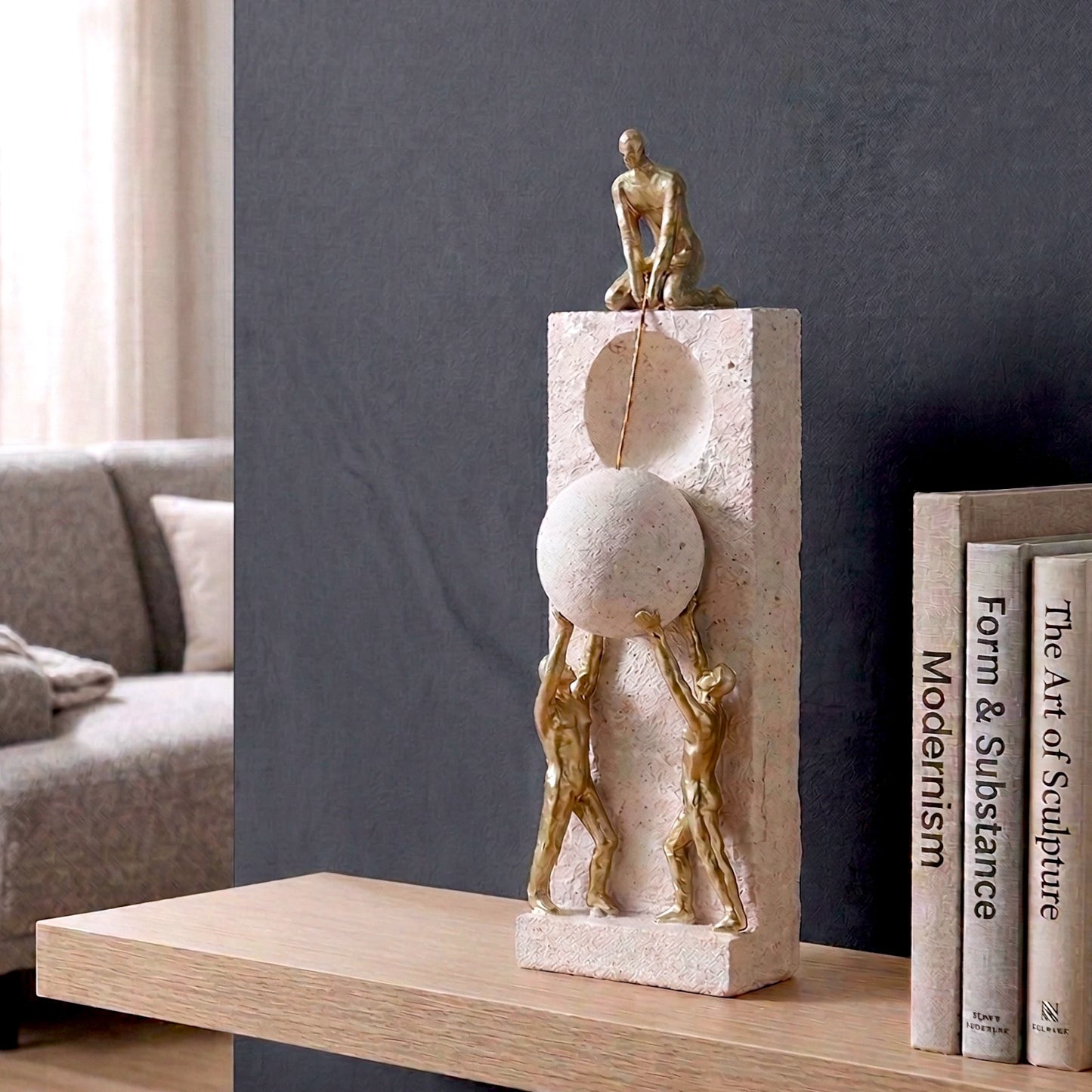 Teamwork figurine sculpture lifting sphere on textured stone base in black and white variants