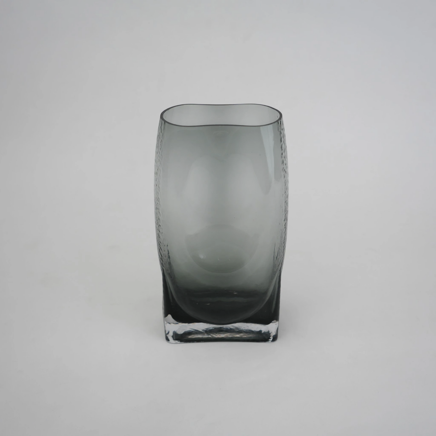 grey modern glass vase with curved interior design