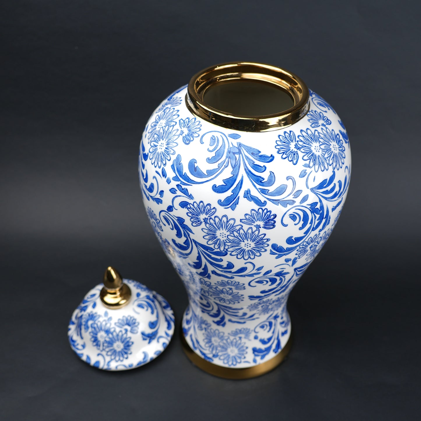 Blue and white ceramic jar with floral design and lid for home decor styling