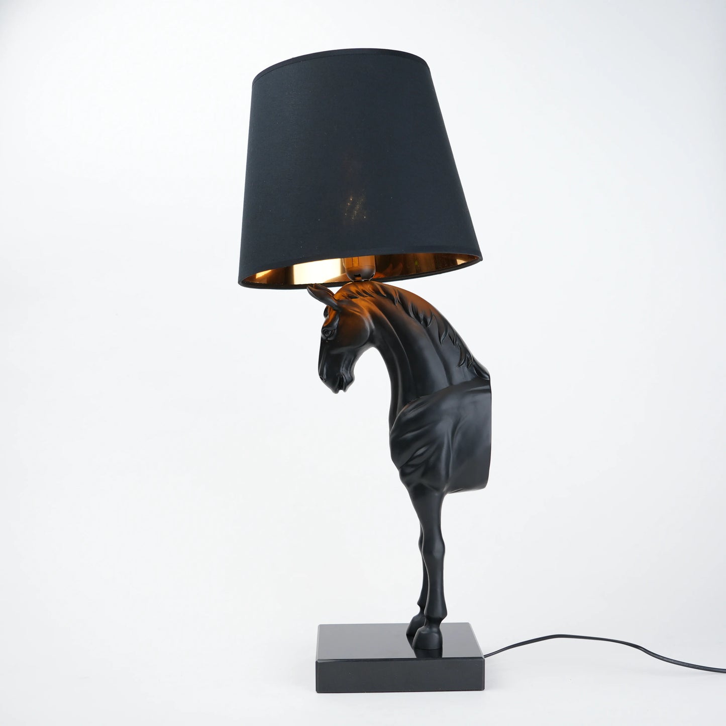 Horse table lamp featuring a detailed horse-shaped base with a premium finish, paired with a fabric lampshade that provides soft ambient lighting, designed as a decorative and functional lighting piece.