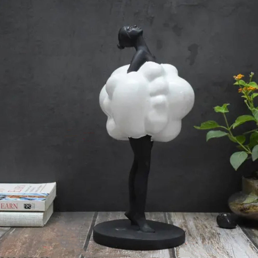 Cloud Lady beside books & plant, rustic wood