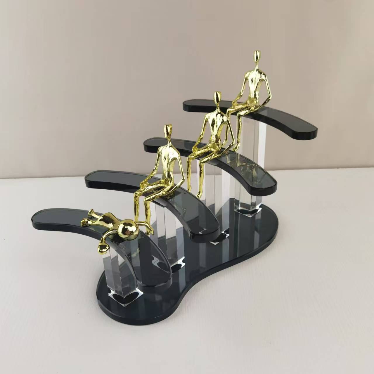 Ascend Form 3/4, brass figures on smoky steps