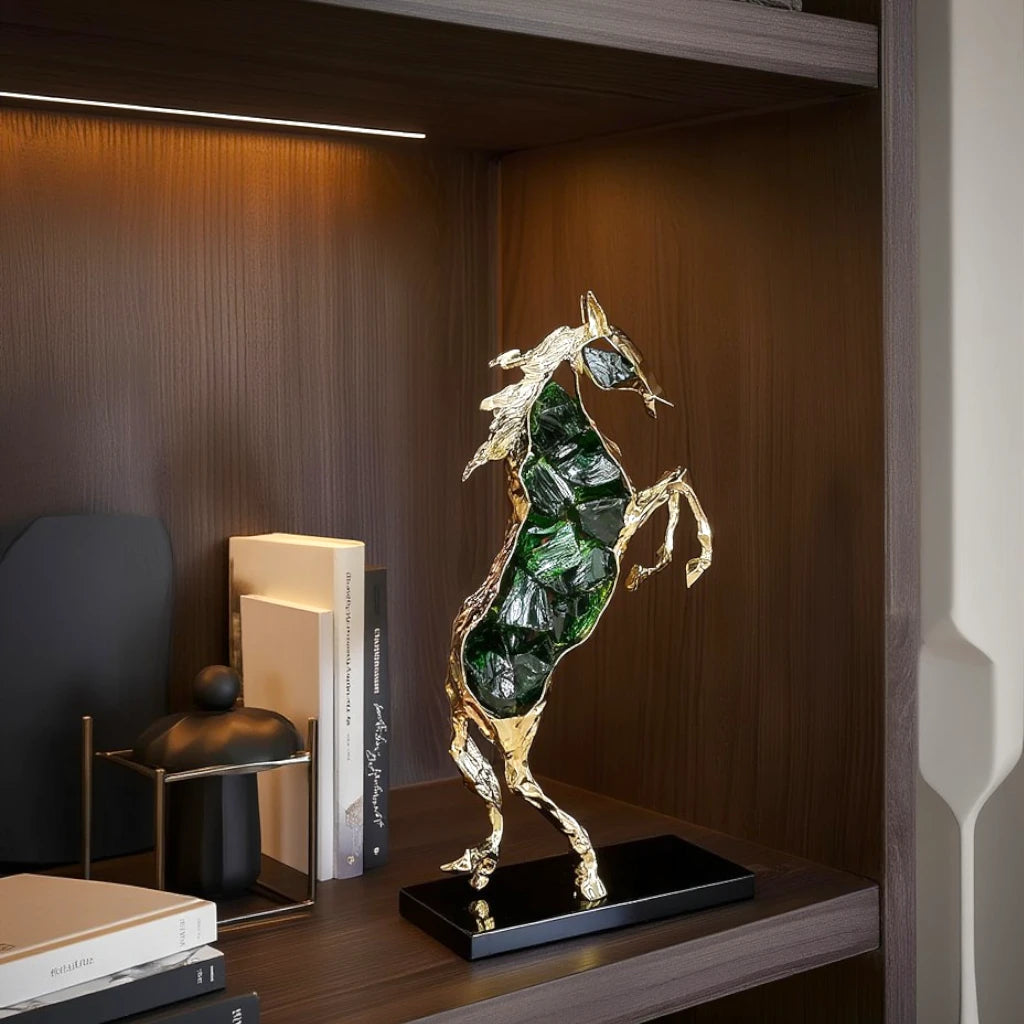 Emerald crystal horse sculpture with gold finish in dynamic galloping form