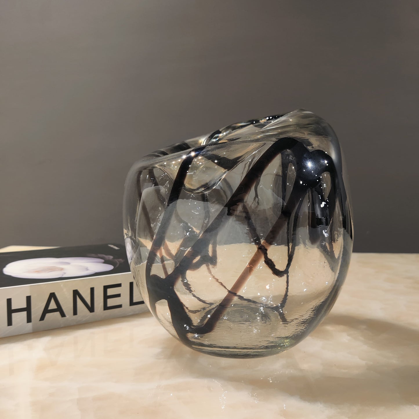 Contemporary smoke glass flower vase with rounded silhouette
