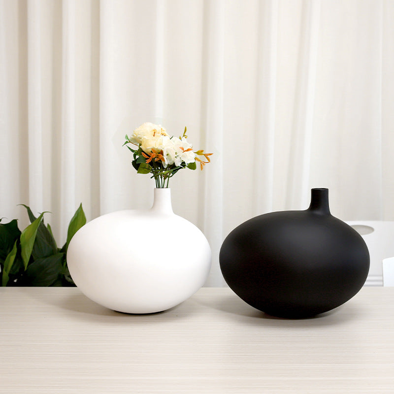 Modern organic shape resin vase with minimalist matte finish for contemporary home decor