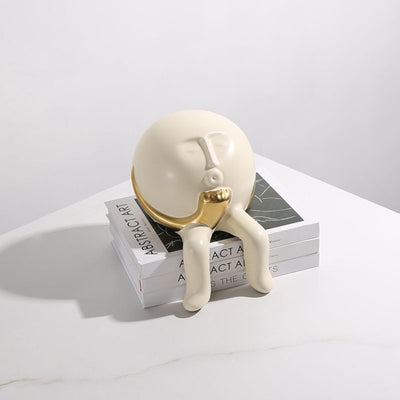 Regal Gaze: White & Gold Face Figurine