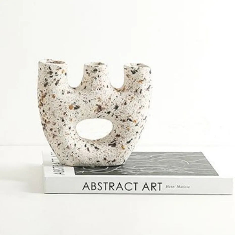 Terra Passage on book stack, abstract art title