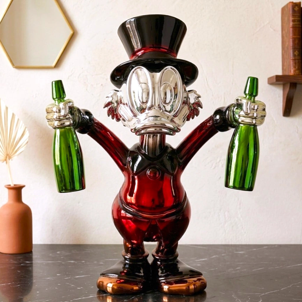 red duck figurine holding green bottle chrome finish luxury cartoon decor accent