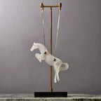 Gold galloping horse decor inside black frame tabletop display