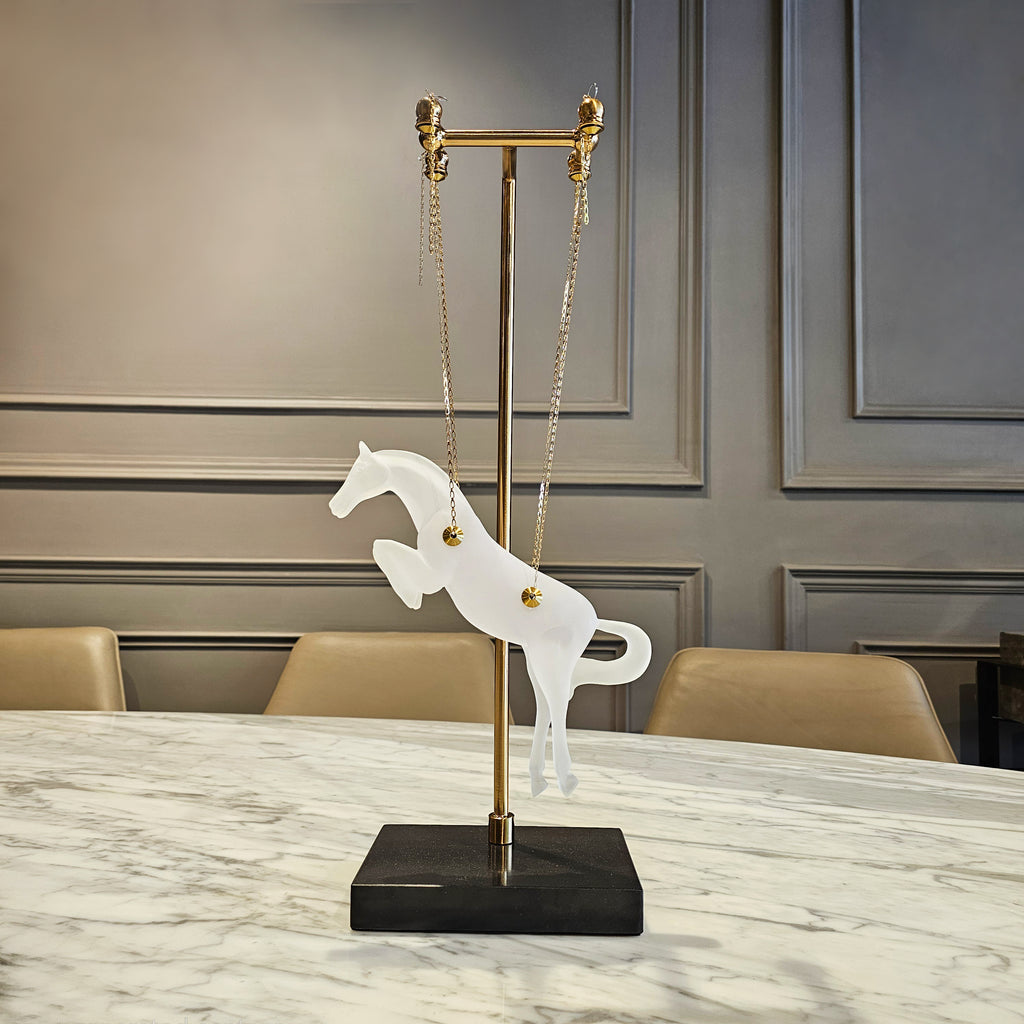 Gold galloping horse decor inside black frame tabletop display