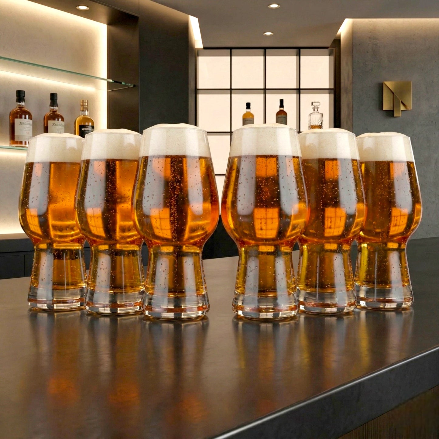 Contemporary beer glass set arranged in a stylish home bar interior with warm ambient lighting and premium drink presentation
