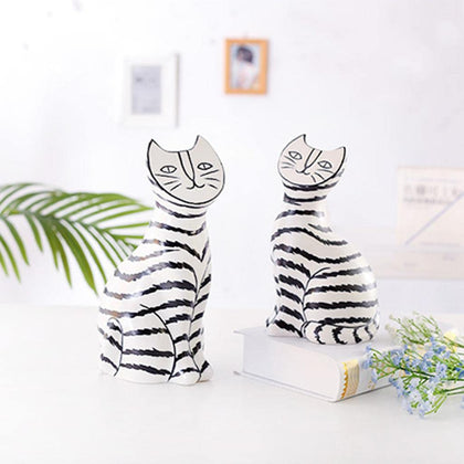 Artistic Cat pair w/ palm leaf and book