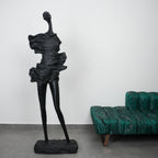 tall black sculpture human form living room statement piece