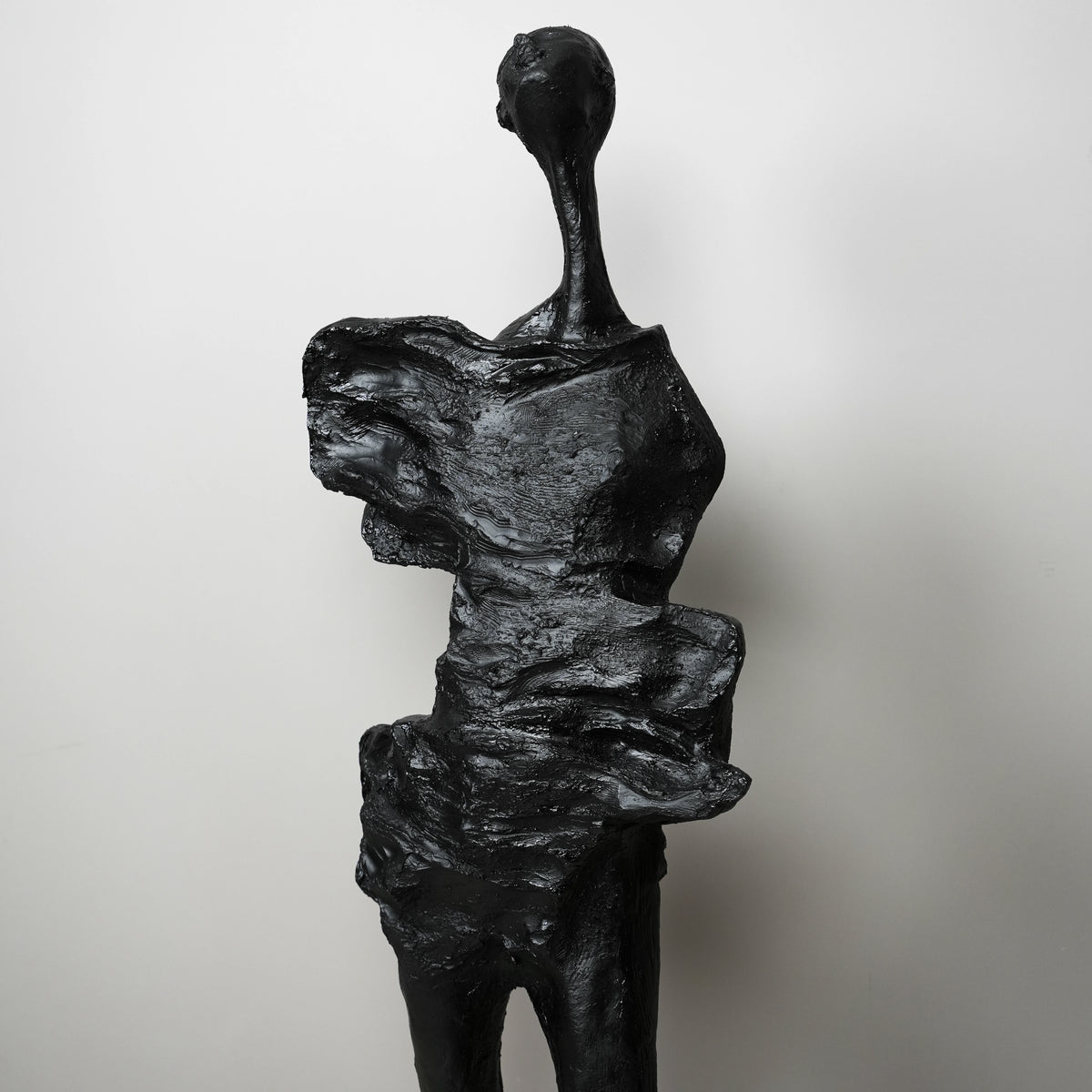 Abstract black sculpture on a white background