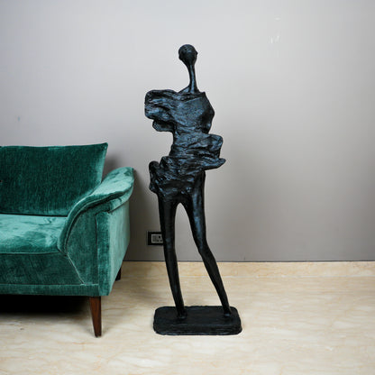 tall black sculpture human form living room statement piece