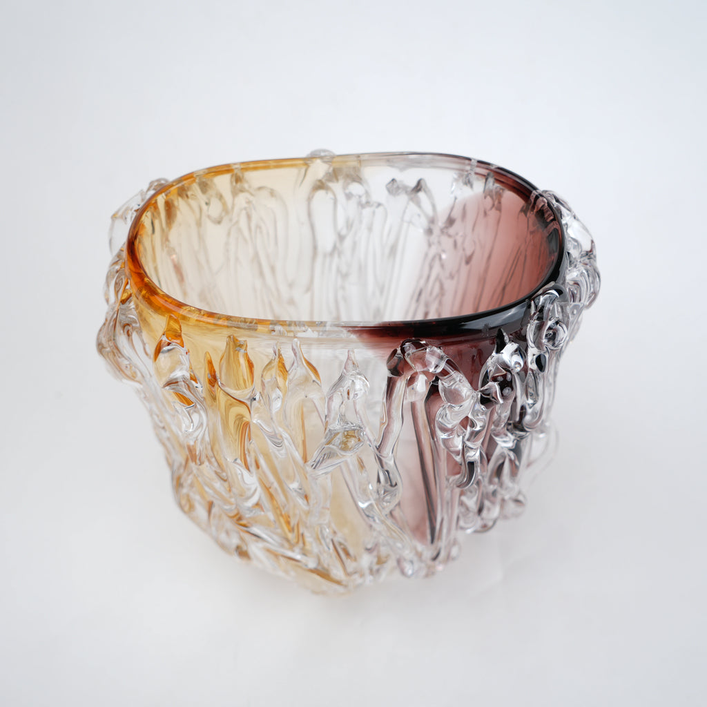 Dual tone glass vase with amber and rose tint and textured molten design in two sizes