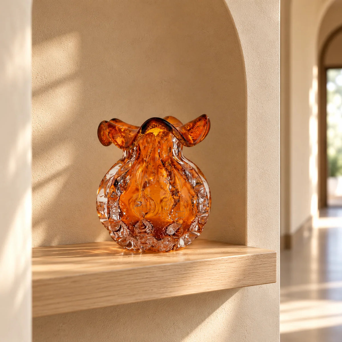 Sculptural amber-toned art glass vase with textured molten-inspired silhouette.