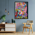 A vibrant abstract face painting displayed on a wall above a modern sideboard, featuring bold geometric patterns and a mix of bright colors.