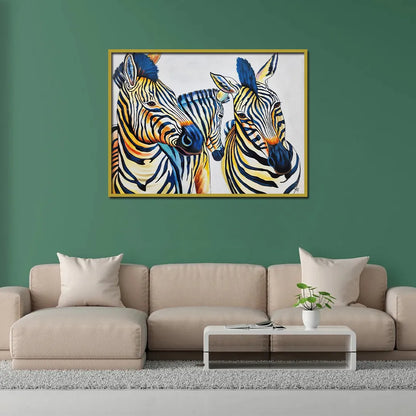 Contemporary zebra canvas painting featuring three zebras with vibrant blue, yellow, and black artistic accents.