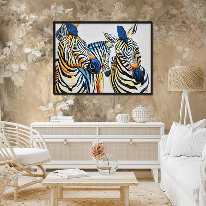 Contemporary zebra canvas painting featuring three zebras with vibrant blue, yellow, and black artistic accents.