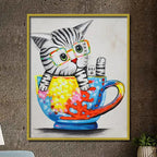 Colorful pop art kitten canvas painting with glasses sitting inside a vibrant teacup featuring abstract artistic details.