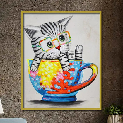 Colorful pop art kitten canvas painting with glasses sitting inside a vibrant teacup featuring abstract artistic details.