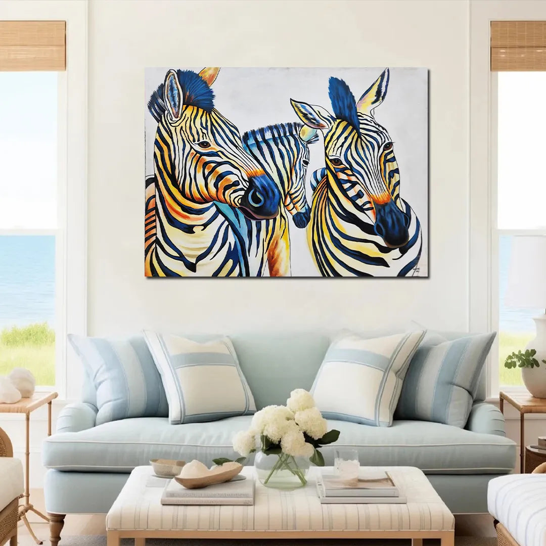 Contemporary zebra canvas painting featuring three zebras with vibrant blue, yellow, and black artistic accents.