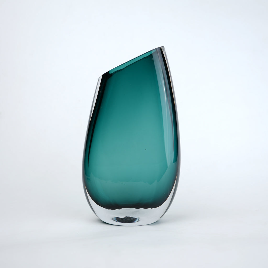 Modern sculptural glass vase collection with rich translucent finish for upscale home decor and designer interiors