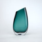 Modern sculptural glass vase collection with rich translucent finish for upscale home decor and designer interiors