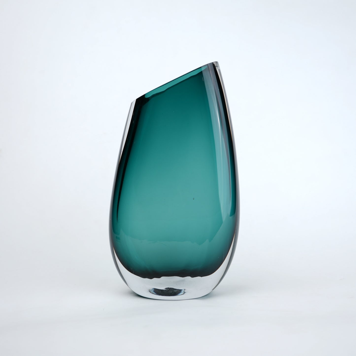 Modern sculptural glass vase collection with rich translucent finish for upscale home decor and designer interiors