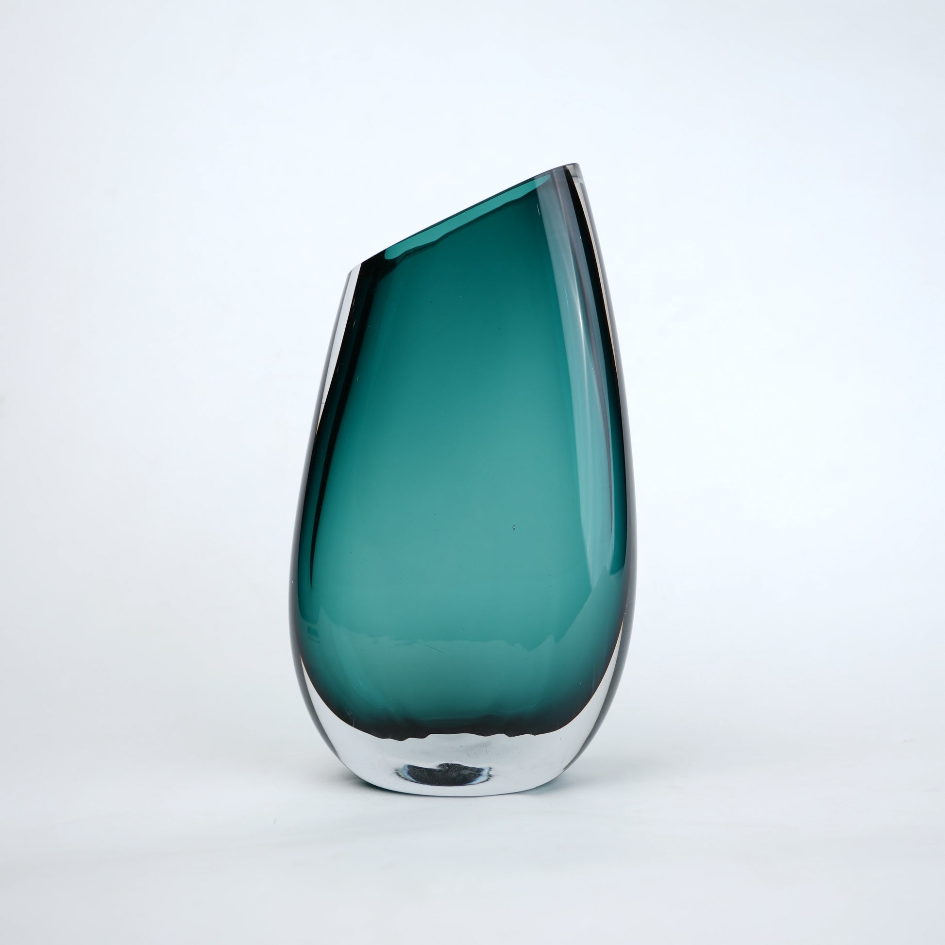 Modern sculptural glass vase collection with rich translucent finish for upscale home decor and designer interiors