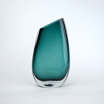 Modern sculptural glass vase collection with rich translucent finish for upscale home decor and designer interiors