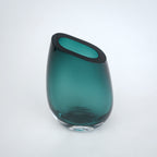 Decorative hand blown glass vase featuring organic asymmetrical form and contemporary luxury aesthetic for stylish homes