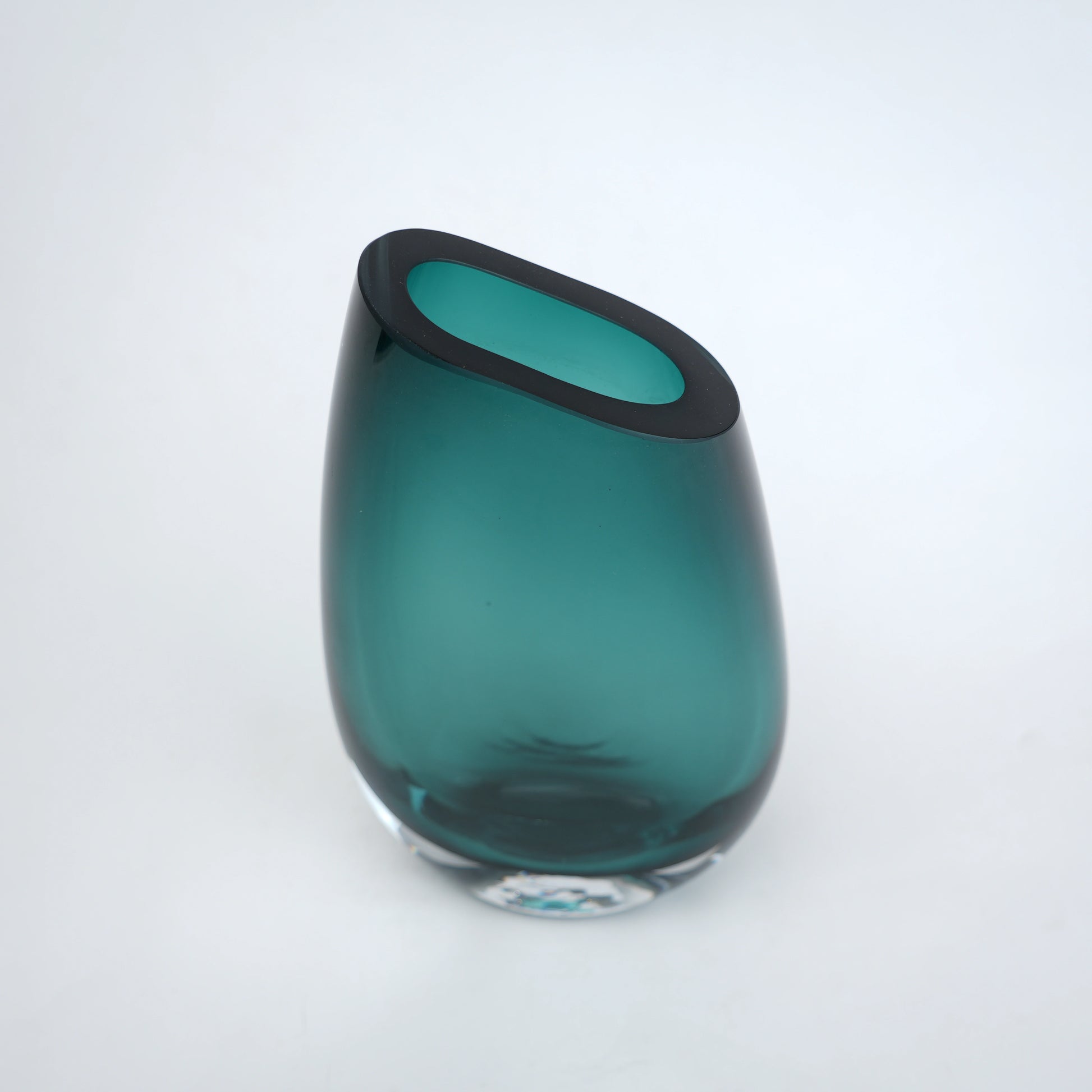 Decorative hand blown glass vase featuring organic asymmetrical form and contemporary luxury aesthetic for stylish homes