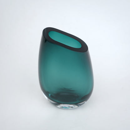 Decorative hand blown glass vase featuring organic asymmetrical form and contemporary luxury aesthetic for stylish homes