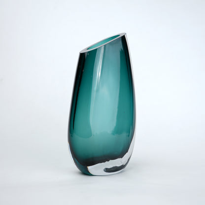 Contemporary colored glass vase designed for floral arrangements, decorative styling and elegant modern living spaces