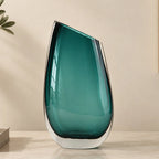 Modern sculptural glass vase collection with rich translucent finish for upscale home decor and designer interiors