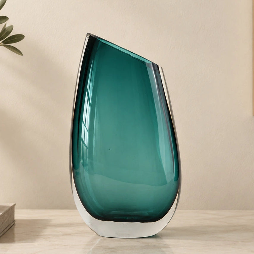 Modern sculptural glass vase collection with rich translucent finish for upscale home decor and designer interiors
