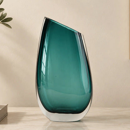 Modern sculptural glass vase collection with rich translucent finish for upscale home decor and designer interiors